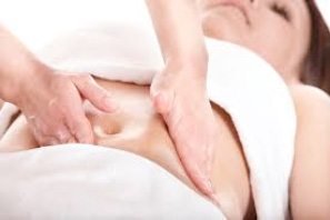 An image of a woman getting a fertility massage